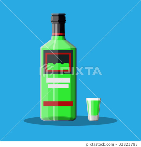 Bottle of absinthe with shot glass. 32823785