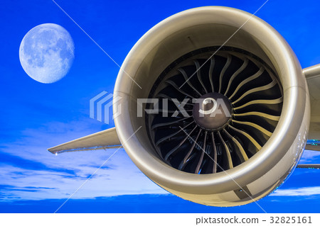 jet engine with full moon at twilight sky 32825161