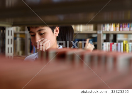 University student doing research in library 32825265
