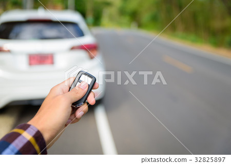 Men on hipster shirt, hand presses on the remote Men on hipster shirt, hand presses on the remote 32825897