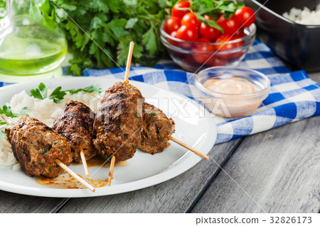Barbecued kofta with rice on a plate 32826173