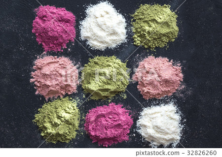 Colorful superfood powders on dark  32826260
