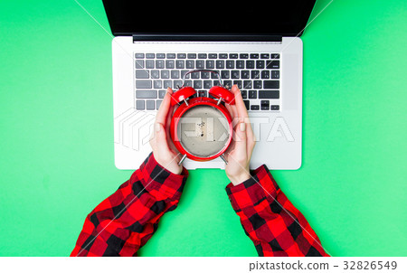 Female holding alarm clock with coffee inside Female holding alarm clock with coffee inside 32826549