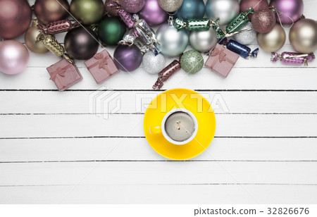 Coffee cup and christmas toys on white background. Coffee cup and christmas toys on white background. 32826676