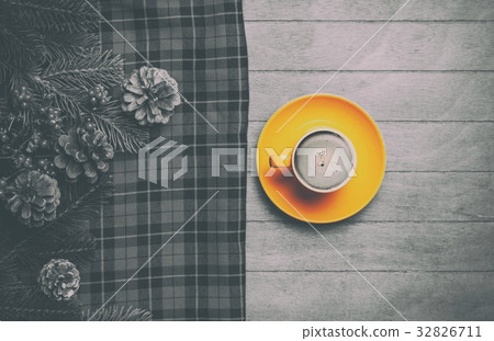 Cappuccino and  pine branch with tartan 32826711