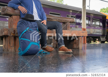 man traveler with backpacker at trainstation 32832314