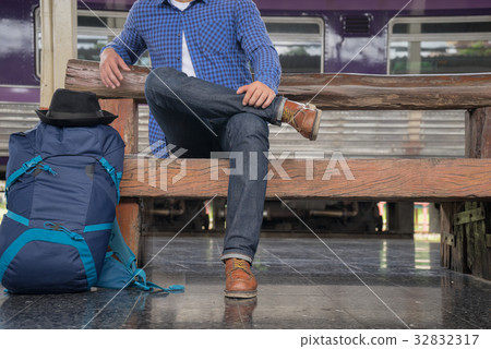man traveler with backpacker at trainstation 32832317