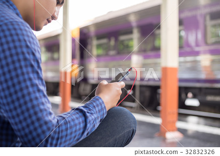 man traveler with backpacker listening to music man traveler with backpacker listening to music 32832326