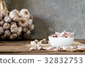 garlic on old wooden table with old wallpaper 32832753