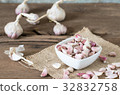 garlic on old wooden table with old wallpaper 32832758