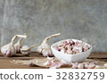 garlic on old wooden table with old wallpaper 32832759