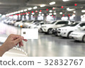 blank card on blurred car parking with bokeh light 32832767