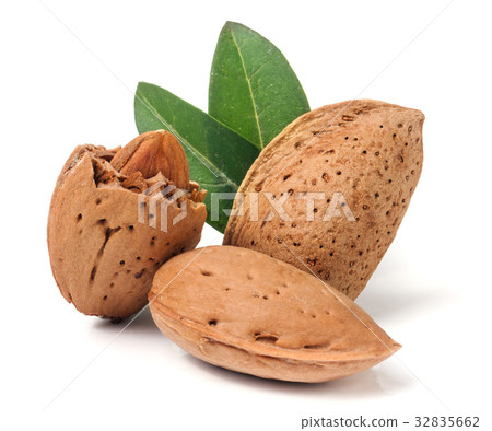 almonds in their skins and peeled with leaf almonds in their skins and peeled with leaf 32835662