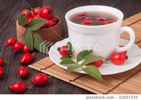 Tea from the hips on the wooden background 32837250