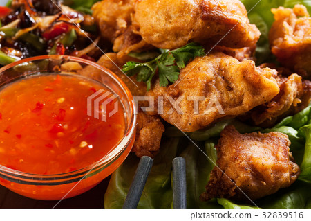 Fried chicken pieces in batter Fried chicken pieces in batter 32839516