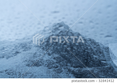 Abstract of Rain drop over the snow mountain background 32841412