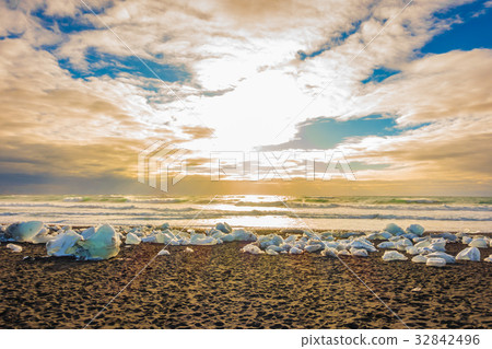 Ice cube breaking on black rock beach , Iceland winter season landscape Ice cube breaking on black rock beach , Iceland winter season landscape 32842496