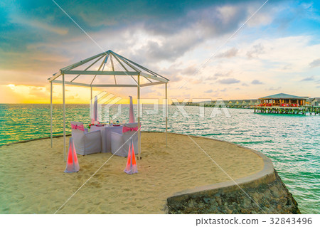 Dining table on beach at tropical Maldives island Dining table on beach at tropical Maldives island 32843496