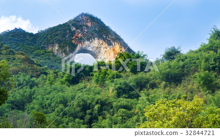 Moon shaped rock, in Yangshuo China Moon shaped rock, in Yangshuo China 32844721