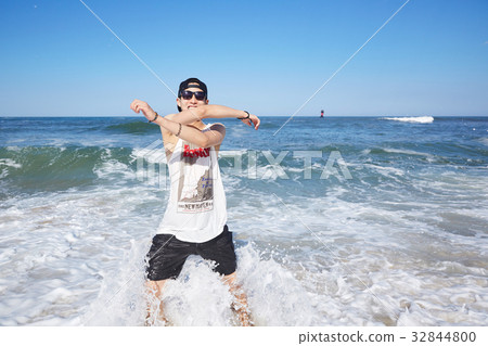Young man, Gyeongpo beach, Gangneung, Gangwon-do, Korea 32844800