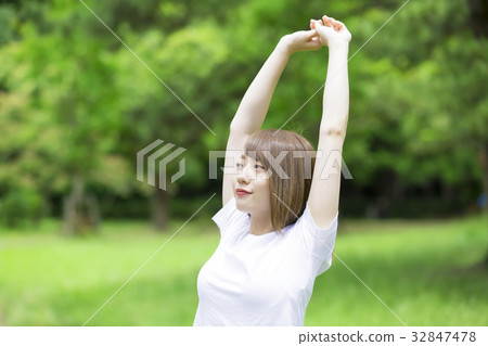 Stretching woman fresh green background Stretching woman fresh green background 32847478