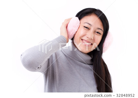 happy, smiling asian-caucasian woman with earmuffs happy, smiling asian-caucasian woman with earmuffs 32848952