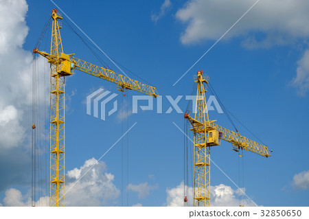 Tower crane on a background of clouds Tower crane on a background of clouds 32850650