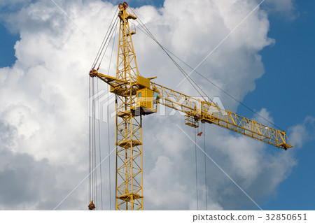 Tower crane on a background of clouds Tower crane on a background of clouds 32850651