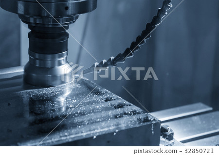 The CNC milling machine cutting the raw material The CNC milling machine cutting the raw material 32850721