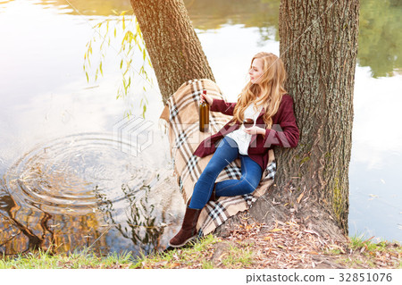 Beautiful woman drinking wine outdoors having Beautiful woman drinking wine outdoors having 32851076