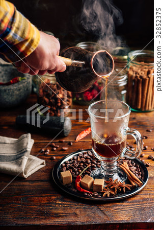 Man Pour Coffee in Mug. 32852375