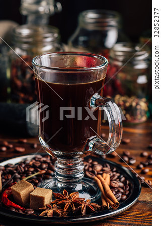 Cup of Coffee with Different Spices. 32852377