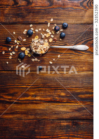 Spoonful of Granola and Blueberry. Spoonful of Granola and Blueberry. 32852390