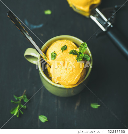 Mango sorbet ice cream scoops with mint, square 32852560