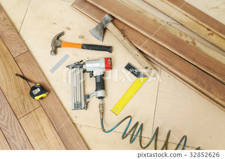 Installing a wooden floor. 32852626