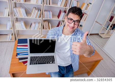 Young student with books preparing for exams Young student with books preparing for exams 32854305