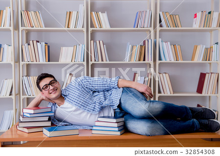 Young student taking break and falling asleep Young student taking break and falling asleep 32854308