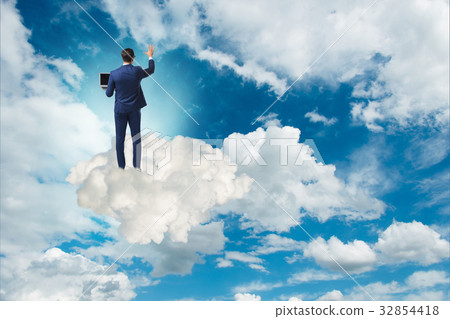 Businessmam pressing virtual buttons in the sky Businessmam pressing virtual buttons in the sky 32854418
