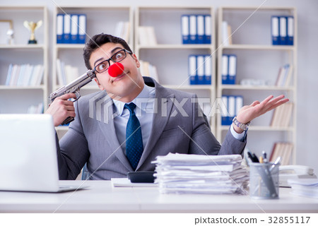 Clown businessman working in the office frustrated 32855117