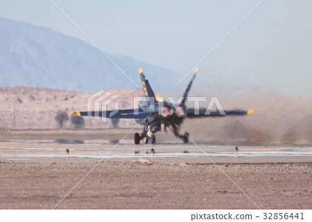US Navy aerobatic flight team taking off in the blaze, Blue Angels F / A-18C Hornet 32856441