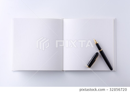Fountain pen on a blank book 32856720
