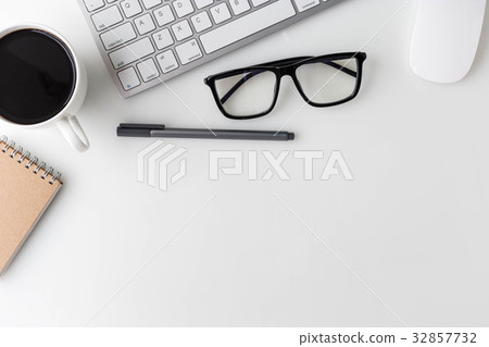 Modern White office desk top and other supplies. 32857732