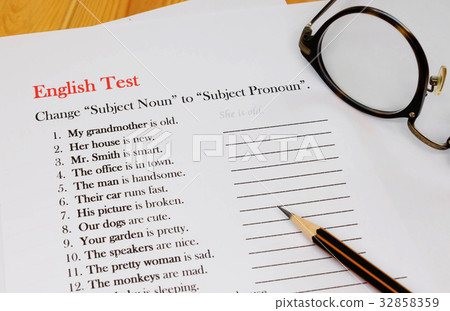 English test sheet on wooden desk 32858359