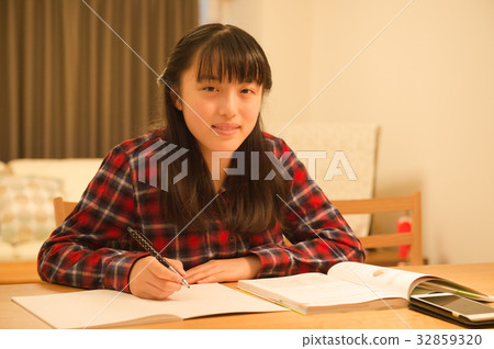 Girl studying for exam Girl studying for exam 32859320