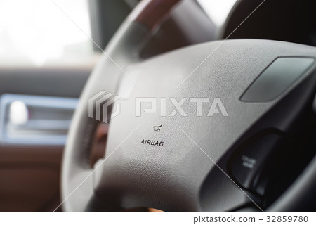Car steering wheel with shallow depth of field 32859780