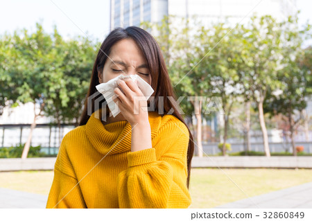 Asian woman use of the tissue 32860849