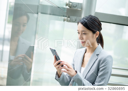 Businesswoman use of cellphone Businesswoman use of cellphone 32860895
