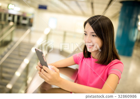 Young Woman using mobile phone Young Woman using mobile phone 32860986
