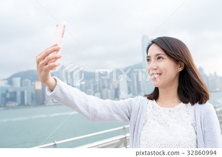 Woman take selfie at outdoor 32860994