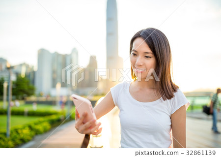 Woman use of mobile phone in Hong Kong Woman use of mobile phone in Hong Kong 32861139